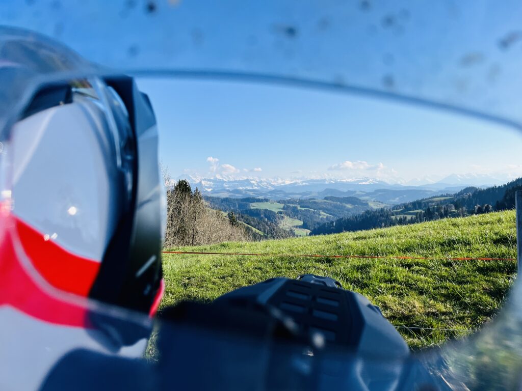 anoramic view from Lüderenalp over the Emmental hills with the Alps in the distance.