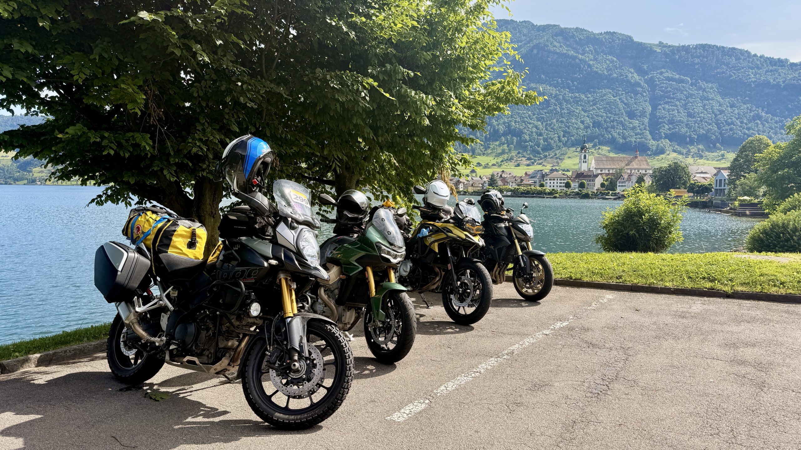 Motorcycles on a Motos & Wonders group tour along the shores of a Swiss lake